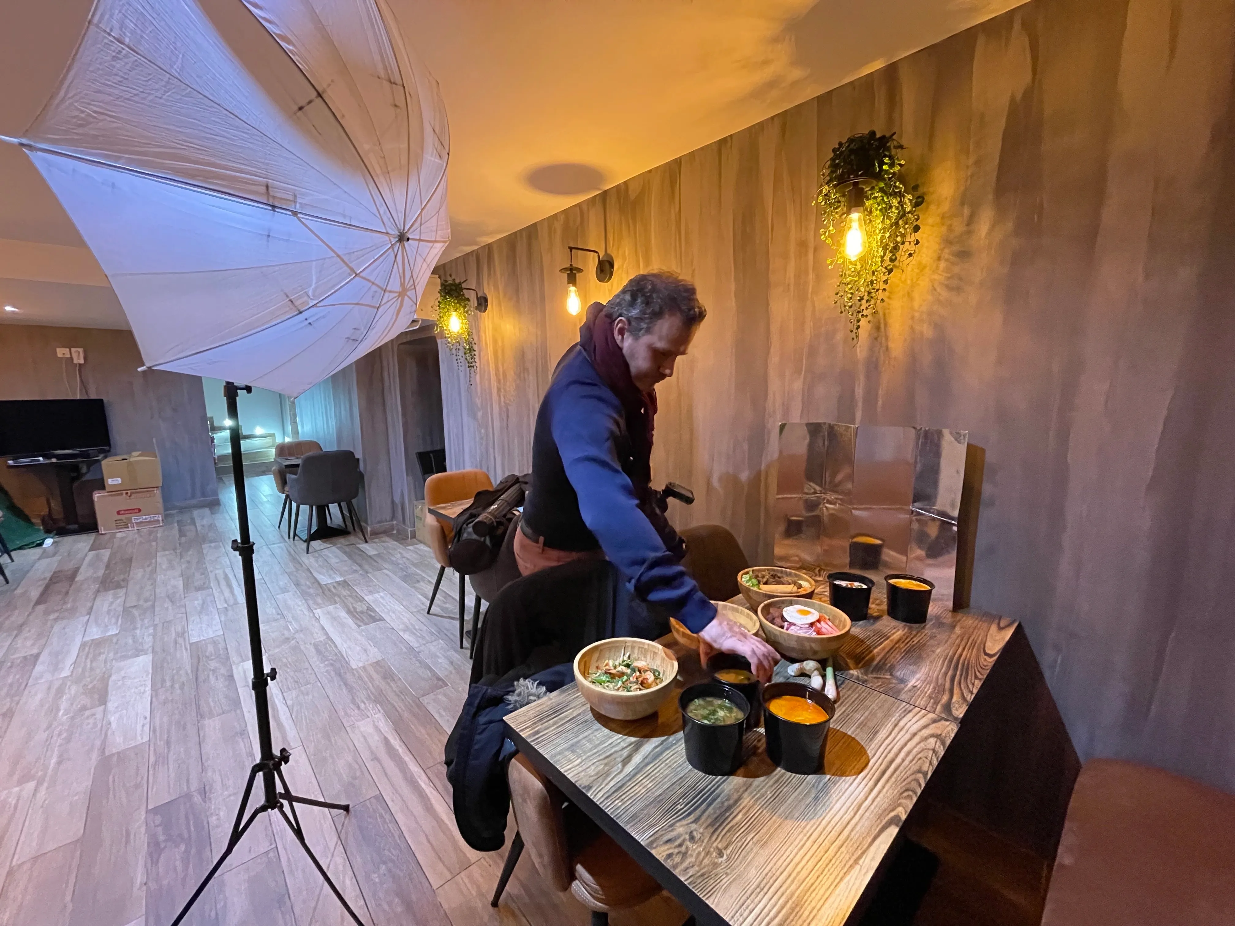 Photographer on set at Sam Thai restaurant